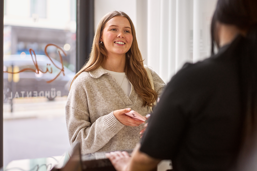 A photograph of a patient at reception